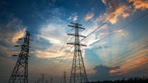 Electricity Pylon power line transmission tower at sunset Electricity Pylon power line transmission tower at sunset